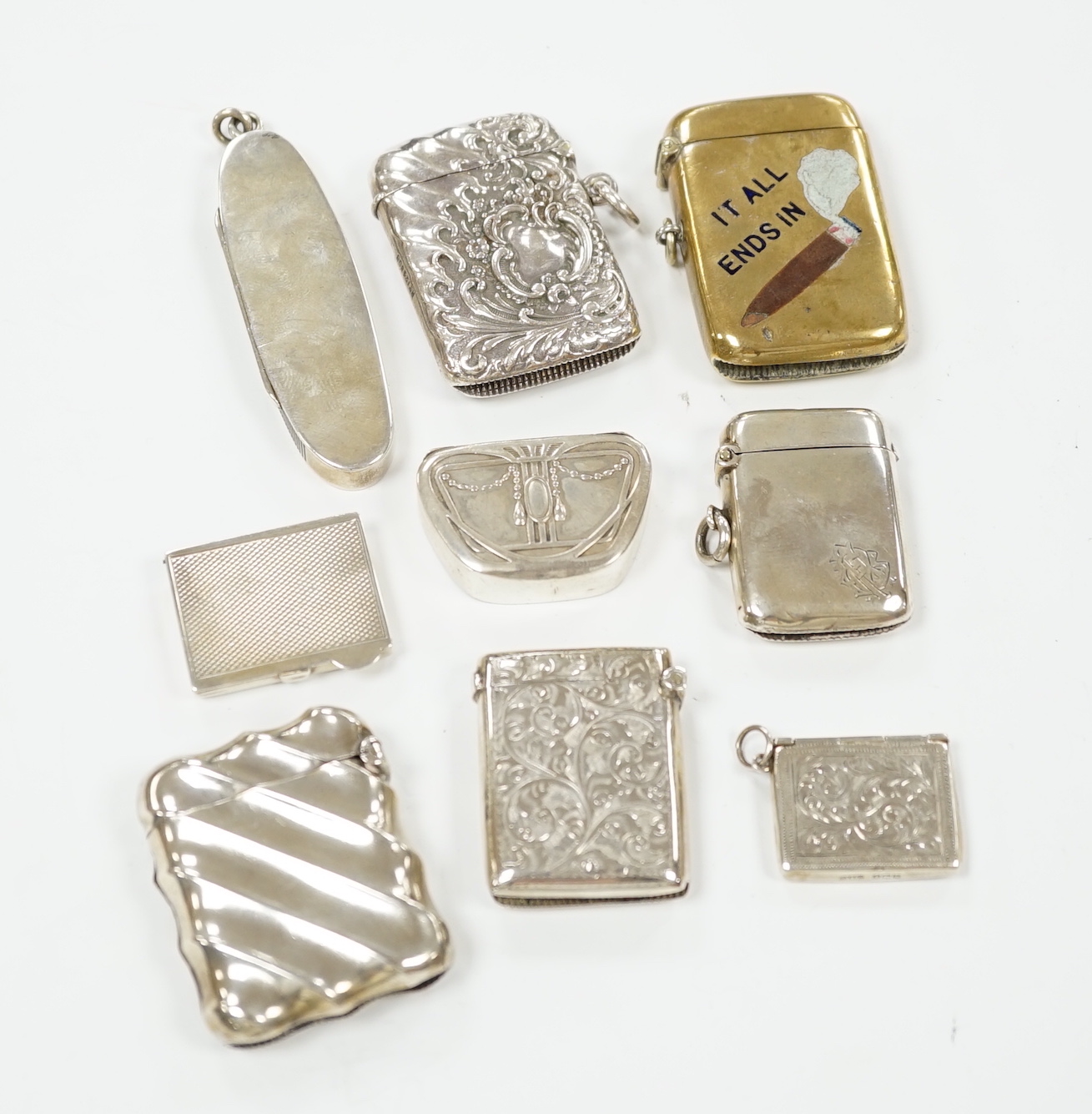 Five assorted silver vesta cases, including Victorian oval by Sampson Mordan, 72mm, a brass and enamel 'It all Ends In' vesta case, two pill boxes and a silver 'envelope' stamp case.